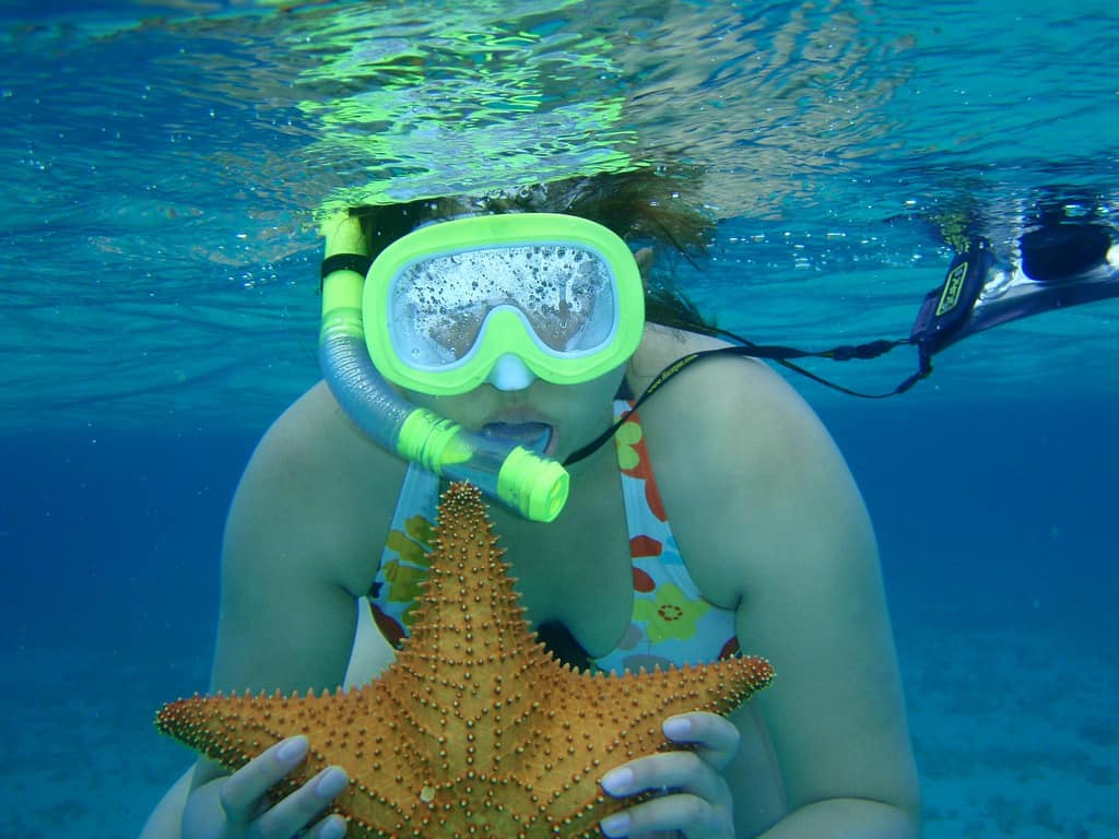Snorkeling in Serenity Bay - Holding a starfish